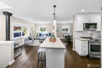Open living space; great light- newer finishes, plus access to a covered deck. Notice the cozy gas fireplace.