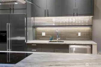 Mosaic glass tile and dramatic lighting up the wow factor.