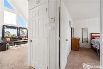 Split view of living room and primary bedroom