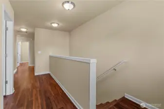 Upstairs and on the stairs you'll find more Laminate Hardwood Floors. (No Carpets in this home!)