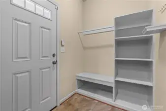 Mudroom w/Custom Built-Ins off the Kitchen leads to the Covered Back Patio. Great Location to store shoes, coats, etc.