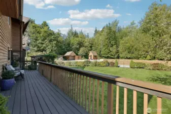 Looking out from the back deck towards one of the many garden spaces and outbuildings.