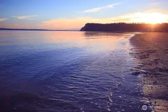 60 feet of waterfront with tideland rights. PLUS Useless Bay State Park is just down the street for miles and miles of beach combing.