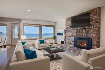Walls of windows capture the views. THREE cozy fireplaces are perfect on stormy nights.