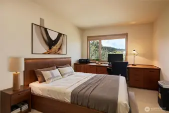 The den is located on the main level and offers tons of built-in cabinets.