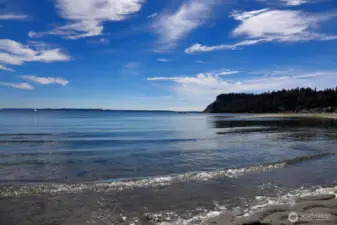 You can walk out a long ways in low tide. Its sandy!
