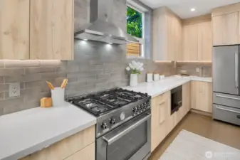 Bertazzoni 6-burner extra wide range and Bertazzoni fridge.