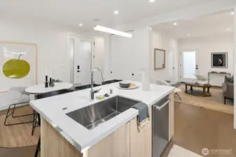 Kitchen with dining area and living room is off to the right in this photo. The door at the back of the living room area leads to a fenced courtyard area. Across the courtyard is a back entrance to the Carriage house.