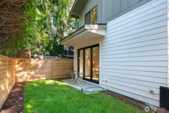 Another shot of the fully fenced, level backyard of the detached home.