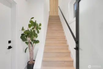 This photo shows the stairs just as you enter the carriage house. The door on your left takes you into the garage.