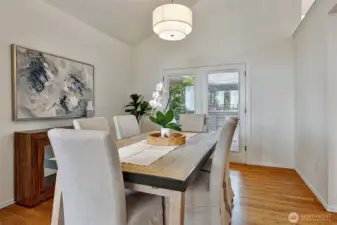 Formal dining room w/double french doors that open to the deck and back garden.