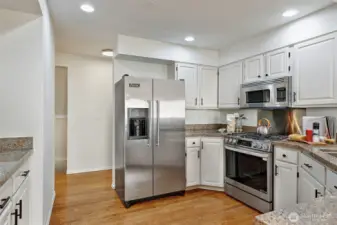 Hardwood floors throughout living/kitchen/dining areas.