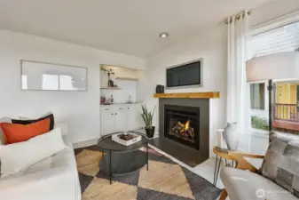 Gas log fireplace and wet bar in family room.