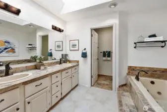 5-piece primary bathroom w/jetted soaker tub, shower and double sinks.