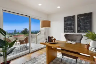 Upper room off primary, with sliding doors to view balcony.  This would make a great office, or nursery