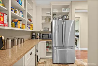 butler's pantry with full sized fridge