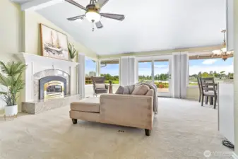 The living room has vaulted ceilings and a gas fireplace.