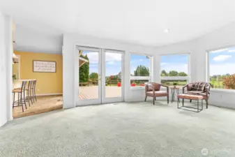 The large back deck can be accessed from the Living Room, Kitchen, and the Family Room.