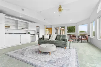 There is a wet bar and additional cabinets for plenty of storage.