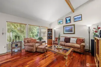 The Brazilian Koa floors are a beautiful and striking feature of the living room.