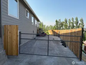 Large parking area and access to backyard.