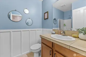 3/4 bathroom downstairs across from Main level bedroom - Stand up shower, toilet, sink