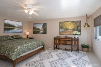 The primary suite offers ample room for a sitting area and offers a relaxing, personal retreat.