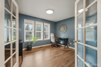 To the left of the entry is the den/office with double glass doors.