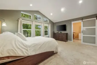 Sliding "barn" door fits well with the decor.  Lots of windows well placed to bring the outdoors in!