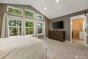 Vaulted ceiling creates exceptional space and allows for a beautiful view of the treed portion of the property!