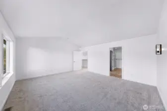 Primary suite with vaulted ceilings and new carpet