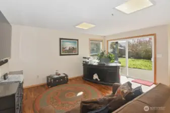 Sliding door to covered patio and fenced backyard.