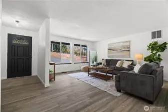 Through the front door is a light filled living room.