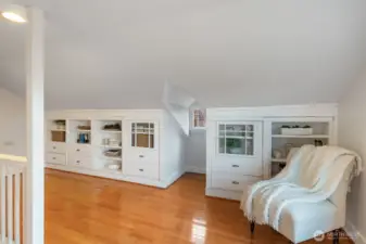 Go upstairs to the converted attic and enjoy the reading nook and storage