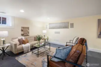 Large bonus room in the basement with surround sound system and lots of storage