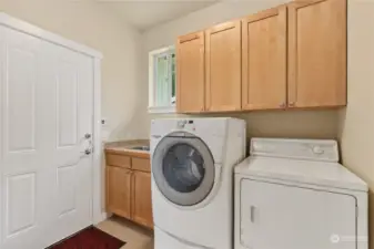 Main floor laundry with utility sink