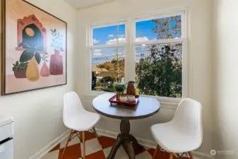 The eating area of the kitchen looks out to the front yard and across Madison Valley.