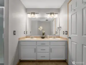 Primary bath includes freshly painted vanity with two sinks and LOADS of storage.