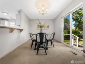 Adjacent to the kitchen is the formal dining area. You can see the slider to the right that leads out to the backyard.