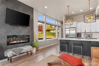 Main level family room open towards the kitchen/eating space.