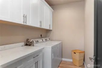 Large laundry room located in the lower level between two additional bedrooms.
