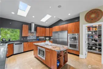 Practical in form and function as well as luxurious, 2 dishwashers, 60 inch side by side refrigerator freezer, finished walk in pantry, the kitchen has everything a discerning chef envisions.