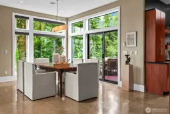 Dine in the treetops. Classic elegance and modern lines with a panoramic backdrop and direct access to the outdoor living experience.