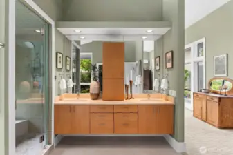 This 5 star spa worthy bath is both elegant and calming, offering warm floors, dual vanities, natural light, and private garden views.