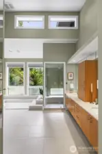 Architecturally significant and utterly serene, this exceptional bath is a rare find—designed with soaring ceilings, clerestory and picture windows for natural light and privacy.  A true retreat that fuses form, function, and tranquility.
