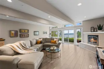 The lower level offers exceptional versatility.  Perfect for extended stay guests, in addition to this spacious family room featuring a gas fireplace, wetbar and direct access to a private patio, it features a bedroom suite with sliding doors to the patio and these amazing views, as well as a bonus/flex room perfect for a gym or additional sleeping space.