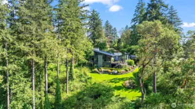 Truly one of a kind!  This home embraces its natural surroundings with understated elegance, bold design and complete privacy.  A true Northwest contemporary retreat.