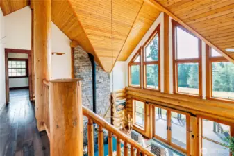 Gallery walk with sweeping views leads to Primary Ensuite & Office.