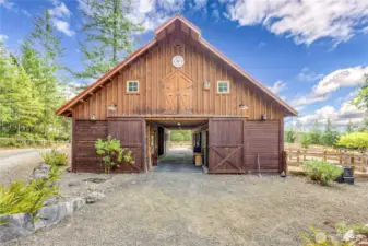 Charming 6-stall barn with tack room & hay loft.