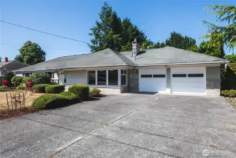 Home sits back from the street and has plenty of parking.